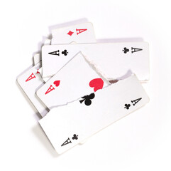 Playing card, torn in pieces