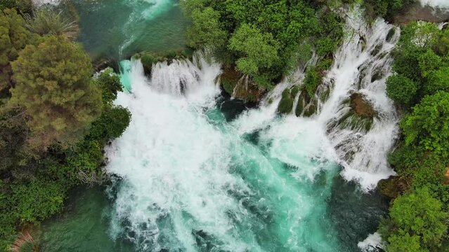 Aerial view of beautiful Krka Waterfalls in Krka National Park, green foliage and turquoise water, Croatia, 4k