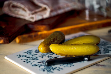 Old-fashioned still life with pickled cucumbers