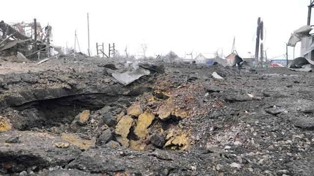 A crater from a rocket attack. Consequences of a rocket attack.
