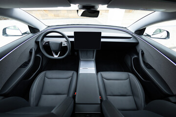 Electric car interior details adjustments. Inside car interior with front seats, driver and passenger, textile, multimedia, windows, console, gear shift, electric buttons, digital speedometer