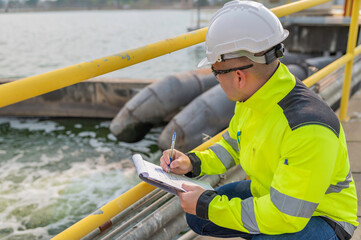 Environmental engineers work at wastewater treatment plants,Water supply engineering working at Water recycling plant for reuse