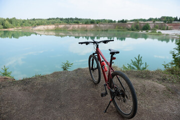 panoramic view of lake, bicycle in foreground