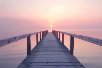 Obraz premium Sun Setting Over the Water at the Pier