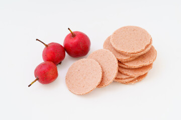 Vintage snack hawthorn slices on white background