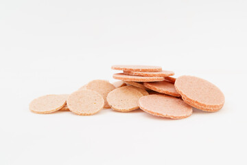 Vintage snack hawthorn slices on white background