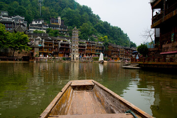 Fenghuang, China - September 30 2015: Boats sail in the river of Fenghuang village in China