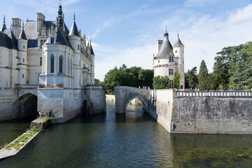 a large white country mansion with normandy style turrets, Chateau de Chenonceau Castle, France
