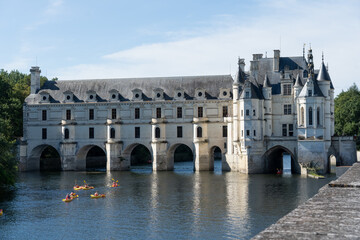 Fototapeta na wymiar canoeists on the river at Chateau de Chenonceau Castle, France