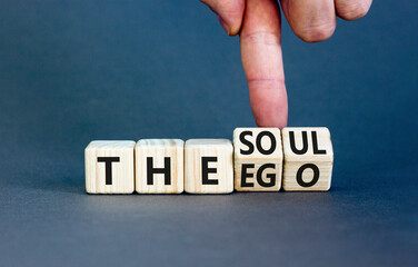 Soul or ego symbol. Concept word The soul or The ego on beautiful wooden cubes. Beautiful grey table grey background. Psychologist hand. Psychological soul or ego concept. Copy space. - obrazy, fototapety, plakaty
