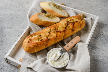 garlic baguette on a gray background