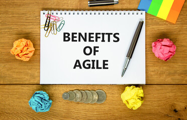 Benefits of agile symbol. Concept words Benefits of agile on beautiful white note. Beautiful wooden...