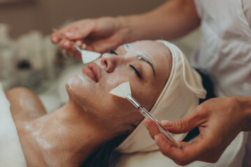 A girl at a cosmetologist does cosmetic procedures. Skin cleansing