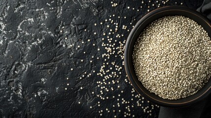 Top view many raw white quinoa seeds on bowl isolated black background. AI generated image - obrazy, fototapety, plakaty