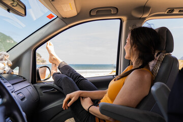 Crossed Legs Of A white Skinned Woman Out Of The Car Window, Travel Concept