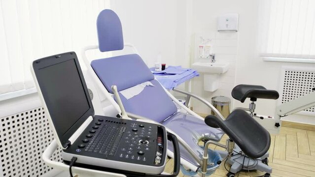 Interior of Gynecology Room in Medical Clinic. Gynecological Bed in Obstetrics and Gynecology Department of Hospital. Pregnancy Planning Concept
