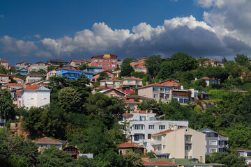 Beautiful houses and city streets of the southern city with green plants, public place in Turkey, on a summer sunny day