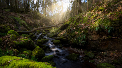 Mountain river in England, dreamy scenery, moss-covered stones and beautiful waterfall in the...