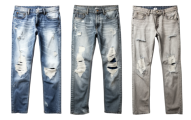 Three unique colored jeans with stylish distressed holes in artistic arrangement