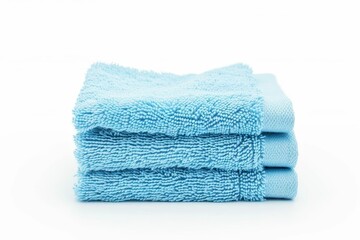 Stack of light blue towels isolated on white background, spa and wellness concept