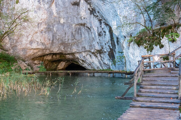 Enchanting hiking trail on rustical wooden footpath to Supljara Cave in Plitvice lakes National...