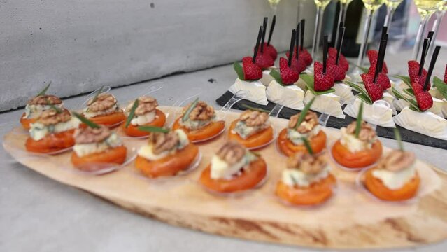 a snacks on the buffet table at the celebration