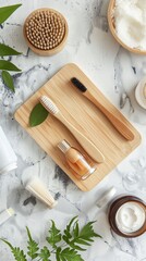 Bamboo brushes and massage comb on a marble background with natural skincare products. Top view eco-friendly bathroom accessories setup