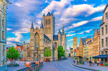 Ghent city historical center with Saint Nicholas Church on Korenmarkt Wheat Market square, Belfry Het Belfort van Gent and row of colorful buildings, East Flanders province, Flemish Region, Belgium