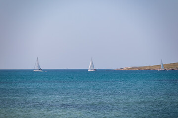Luxury sailing boats floating in port of coastal town Medulin, Pomer Bay, Kamenjak nature park, Istria peninsula, Croatia, Europe. Cruising along coastline of Kvarner Gulf, Adriatic Mediterranean Sea