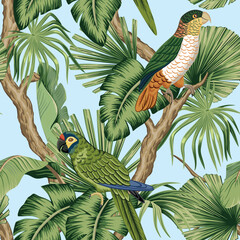 Tropical parrots, bird, green palm leaves floral seamless pattern blue background. Exotic jungle wallpaper.	