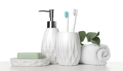 Obraz na płótnie Canvas Bath accessories. Different personal care products and eucalyptus branch on table against white background