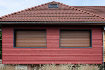 Naklejka premium Ottrott, France - 06 27 2023: Alsatian Vineyard. View of a graphical facade of a new Alsatian house .