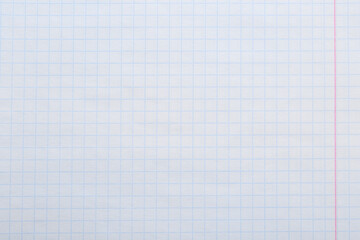 Checkered notebook sheet as background, top view