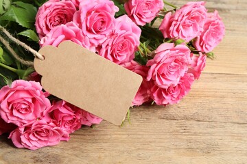 Happy Mother's Day. Beautiful flowers and blank card on wooden table