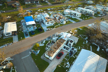 Badly damaged mobile homes after hurricane Ian in Florida residential area. Consequences of natural...