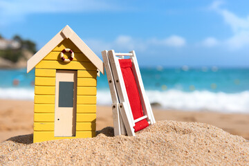 Beach cabin and folded chair - 773424438