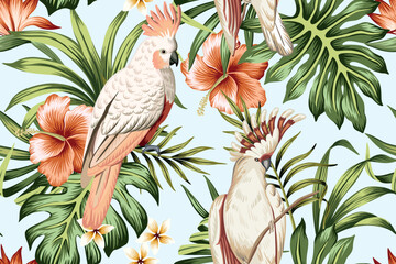 Obraz premium Tropical vintage palm leaves, red hibiscus flower, pink cockatoo parrot floral seamless pattern blue background. Exotic jungle wallpaper.