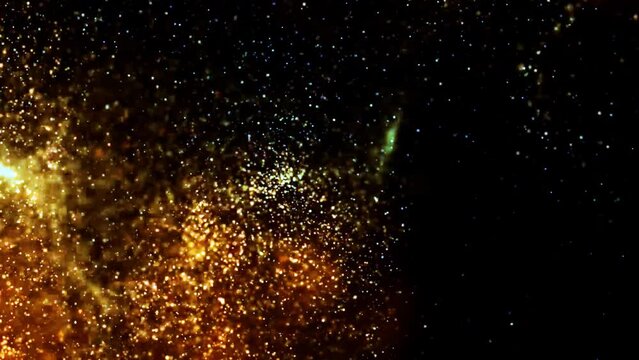 Gold ink in water shooting with high speed camera. Gold glitter background with sparkle shine light confetti. Super Slow Motion at 1000fps. effect. blue glitter