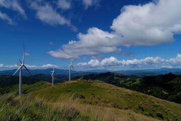 A photo of wind turbines on the grassy hills