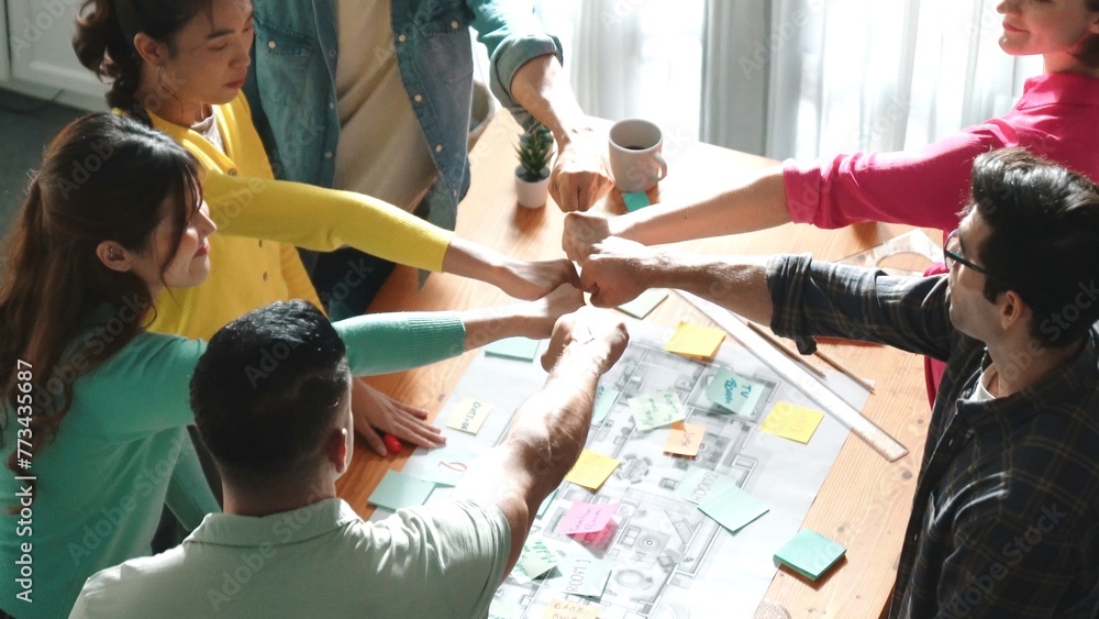 Poster top view of skilled business team work together and putting fist together at meeting room. aerial vi