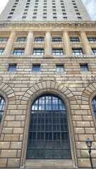 Windows of a building. Facade of an old stone skyscraper.