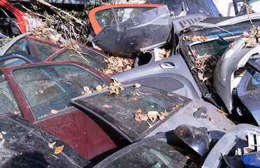 Junkyard in Holland with old and broken cars and photos of carparts