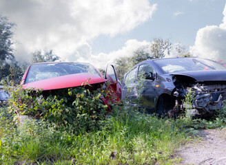 Junkyard in Holland with old and broken cars and photos of carparts