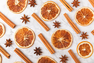 Cinnamon sticks and anise on a textured background. Cinnamon roll and star anise. Spicy spice for...