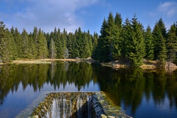 Fototapeta premium Water reservoir on the Bílý potok in the Jizera Mountains. 03-06-2024, Northern Bohemia, Central Europe.