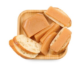 Delicious sweet quince paste and bread isolated on white, top view