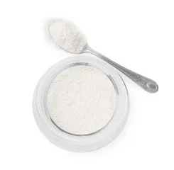 Fotobehang Baking powder in glass jar and spoon isolated on white, top view © New Africa