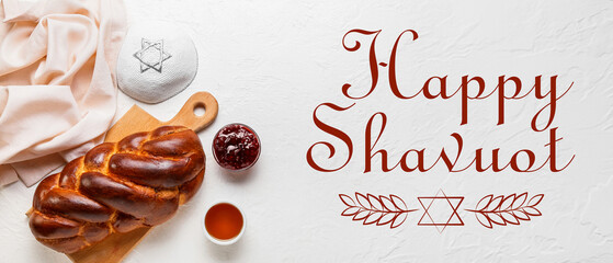 Traditional challah bread with Jewish cap on white background. Shabbat Shalom