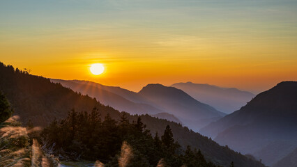 A captivating sunrise scene in late winter at the observation deck of National Taipingshan Forest...