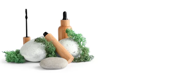 Fotobehang Mascara, bottle of serum, green moss and stones on light background with space for text © Pixel-Shot